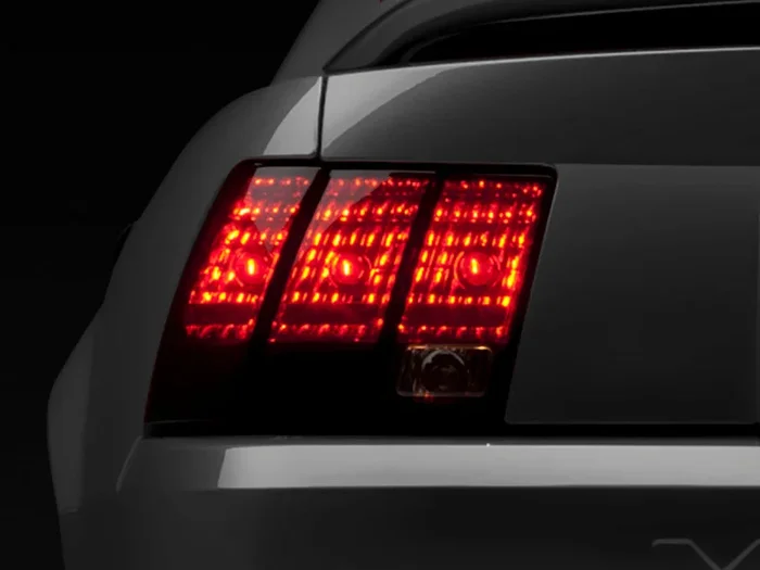 Raxiom 99-04 Ford Mustang Excluding 99-01 Cobra Tail Lights- Black Housing (Smoked Lens)8.4 lb